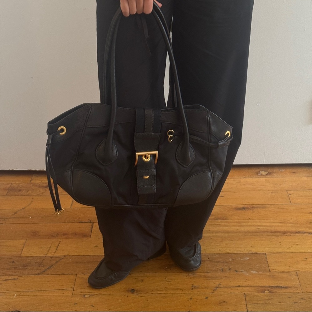 Prada Black Shoulder Bag with Classic Design and Gold Buckle